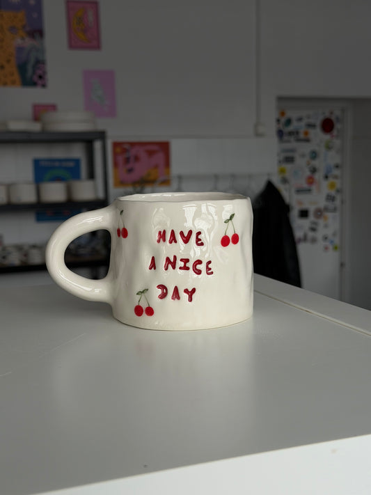 Kubek L "have a nice day"